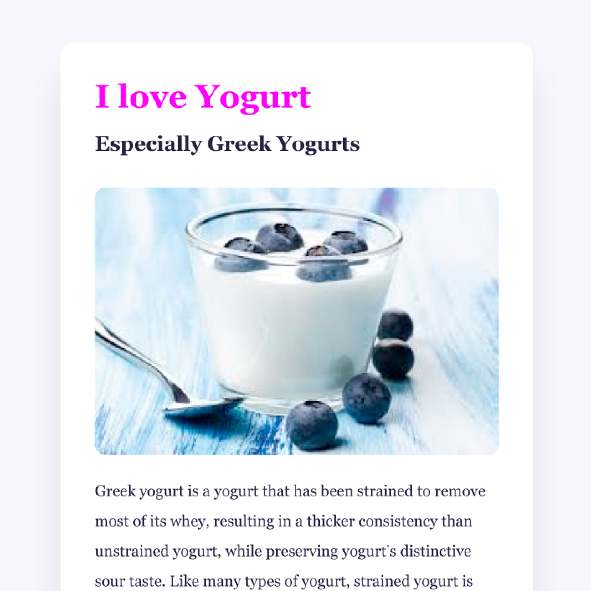 a picture of a cup of yogurt with blueberries and a spoon